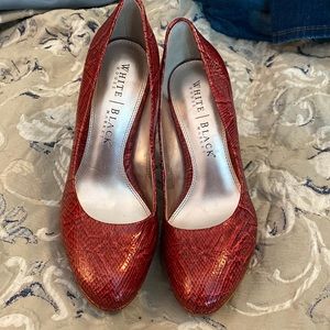 White House Black Market Diane pumps. Rose snake skin pattern. Size 7.